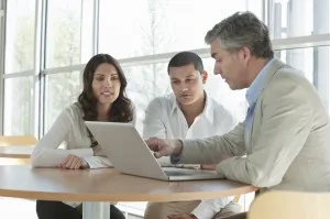 Man Explaining an Investment Plan To Couple